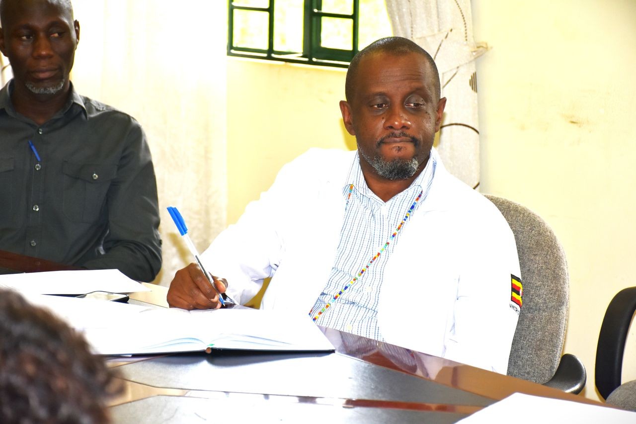 Deputy Executive Director, Dr Mutamba Byamah having a talk with Butabika Veterans Association Members.
